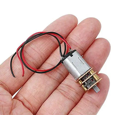 Three Mini Micro N20 Gear Motors DC 3V To 6V With Full Metal Gearbox for DIY projects, shown in hand for size reference.