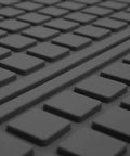 Close-up of Built Tough Heavy Duty Trimmable Cargo Mat Liner with deep traction grips, showcasing textured black rubber surface.