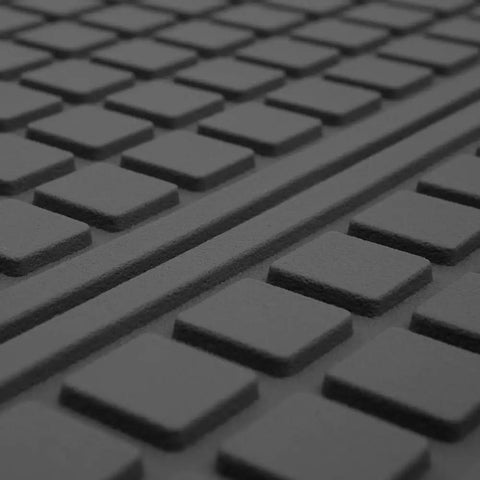Close-up of Built Tough Heavy Duty Trimmable Cargo Mat Liner with deep traction grips, showcasing textured black rubber surface.