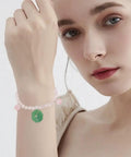 Woman wearing bracelet made with Dope Lotus Acrylic Beads Set, 24 Pieces in 7 Styles, 10-30mm mini flower and leaf beads, for jewelry making.
