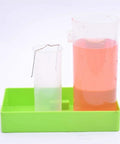 Hands On Physics Lab Kit For Liquid Pressure Depth Relationship, beaker with pink liquid and green tray