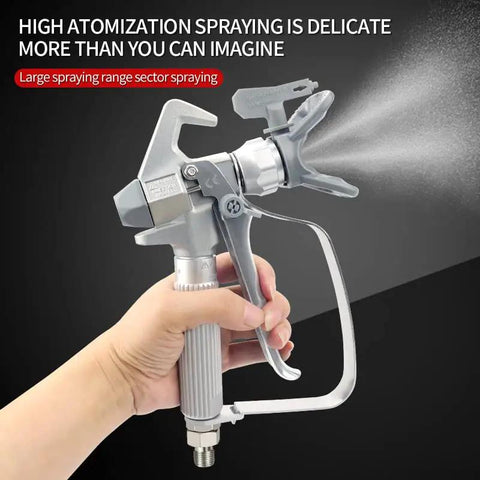 Heavy Duty Airless Paint Spray Gun Packing 3600 Psi With A Wide 517 Tip, held with one hand, spraying smoothly.