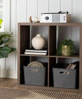 Kick Clutter To The Curb With This Big Slick Gray Woven Storage Basket Featuring Sturdy Cut Out Handles For Roomy Home Organization And Chic Display ThatSeriously Saves Valuable Floor Space Now on wooden shelf with decor.