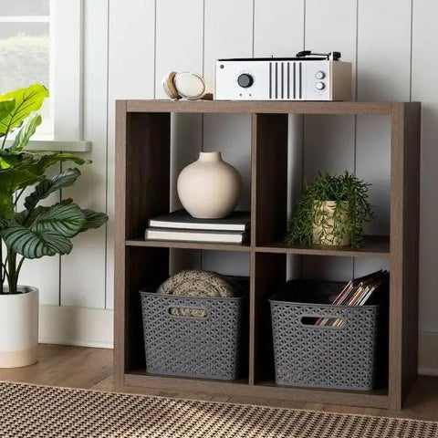 Kick Clutter To The Curb With This Big Slick Gray Woven Storage Basket Featuring Sturdy Cut Out Handles For Roomy Home Organization And Chic Display ThatSeriously Saves Valuable Floor Space Now on wooden shelf with decor.