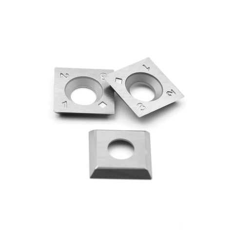 Top view of three 15mm square carbide inserts with central mounting holes for woodturning tools.