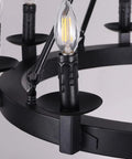 Close-up of Black Farmhouse Wagon Wheel Chandelier With Eight Exposed Lights Dope Industrial Iron Ceiling Fixture In Candle Style