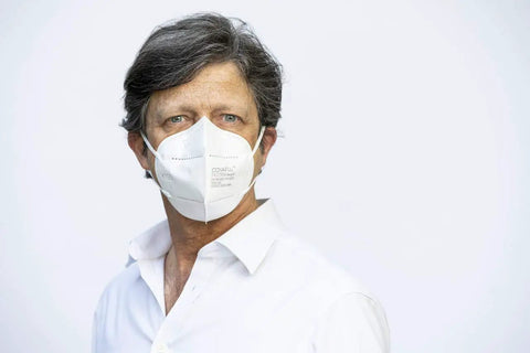 Man wearing Premium KN95 Face Masks for Adults, Pack of 10 Disposable Masks for All-Day Wear and Travel, dust protection