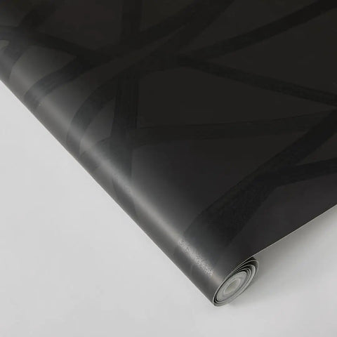 Geometric Metallic Black Intersections Peel and Stick Wallpaper by Genevieve Gorder roll, close-up view showing pattern and texture.