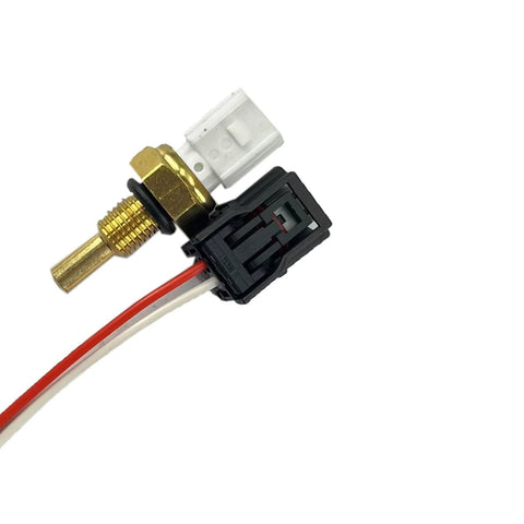 Close-up of coolant temperature sensor with connector harness; brass threaded sensor, white connector, red/white wires.
