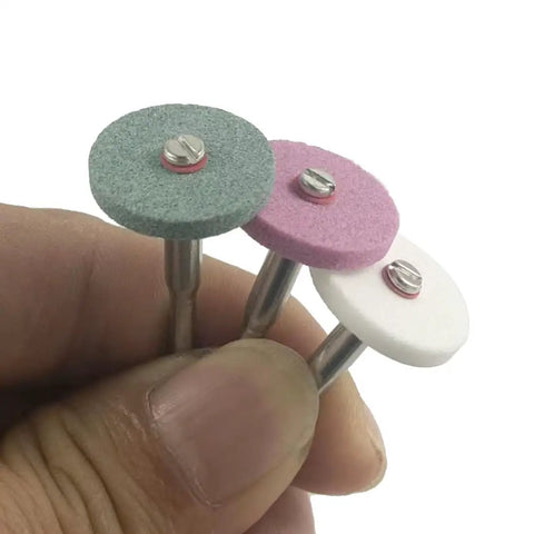 Close-up of three colored aluminum oxide wheels from Rotary Grinding Stone Set 50 Pcs With Eighth Inch Shank Aluminum Oxide Mounted Grinding Wheels