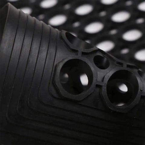 Close-up of heavy-duty drainage design on Anti Fatigue Drainage Rubber Matting For Indoor And Outdoor Use Built Tough, Heavy Duty Non Slip Floor Mats For Workshops Kitchens And Commercial Spaces, Water And Grease Resistant, Cold Weather Durable UV Protected.