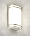 LED wall sconce featuring a brushed nickel finish and a curved white shade, ideal for bedrooms and hallways. Kick Your Lighting Game Up Today With This Sleek Indoor LED Wall Sconce Sporting Brushed Nickel Finish And Adjustable 3000K 4000K 5000K Temps Plus Zero Hassle Mount And A Smooth Rust Proof Glow Built For Everyday Chill.