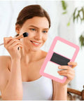 Woman using Pink Magnetic Locker Mirror 5 By 7 Inches Real Glass With Strong Magnetic Backing Perfect For School Lockers