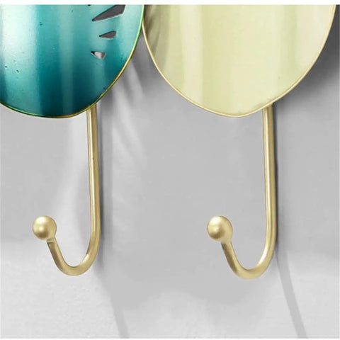 Close-up of Heavy Duty Iron Wall Mounted Coat Hooks And Scarf Organizer With Sleek Geometric Lines, featuring hooks for coats.