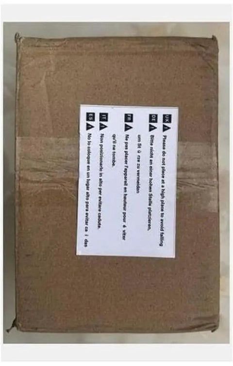 Brown cardboard box with multilingual warning label for handling instructions, suitable for shipping Heavy Duty Electric Tapping Arm.