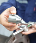 SUS304 Heavy Duty Stainless Steel Two Hole Pin With Push Button Quick Lock For Pipe Alignment held in hand for rigging work.