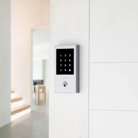 High End Oil Rubbed Bronze Touchscreen Deadbolt With Zwave Smart Home Link And Keyless Entry Crafted From Solid Brass mounted on a white wall.