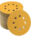 Get The 150 Pack Of High Performance 5 Inch Hook And Loop Sanding Discs With Versatile Aluminum Oxide Grits For Smoother Orbital Sander Projects That Fly Off Clogging And Hold Tough, showing 5 inch yellow sanding discs with holes.