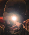 Man wearing PowerCap Hat Clip On Lamp Rechargeable LED Headlamp Hands Free Ultra Bright With 3 Lighting Modes in low light