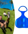Man sliding on grass with Heavy Duty Snow Sled For Winter Fun And Family Thrills, Large Luge Board For Snow Sand Grass Sliding shown in blue.