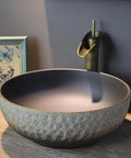 USZWBY Vessel Sinks Wash Basin Ceramic Art Table Retro Wash Basin Bathroom Wash Basin Round Home Bathroom Sink with a textured design.