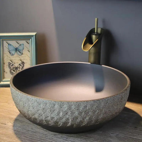 USZWBY Vessel Sinks Wash Basin Ceramic Art Table Retro Wash Basin Bathroom Wash Basin Round Home Bathroom Sink with a textured design.