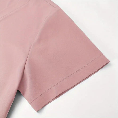 Close-up of the pink sleeve from the V Neck Quick Dry Scrub Set For Beauty Salons And Pet Shops Pink XL 3 Piece Workwear