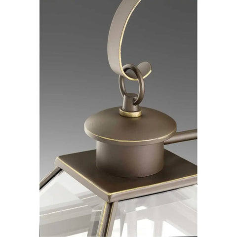 Close-up of Burlington Two-Light Hanging Lantern In Oil Rubbed Bronze Finish, featuring metal hook and clear beveled glass.