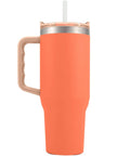 Rock Solid 40 Oz Stainless Steel Vacuum Insulated Tumbler with Copper Plate Technology in coral color with straw and handle.