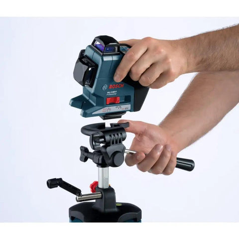 Person adjusting a lightweight heavy duty aluminum elevator tripod with precise centimeter and millimeter and feet and inches graduations