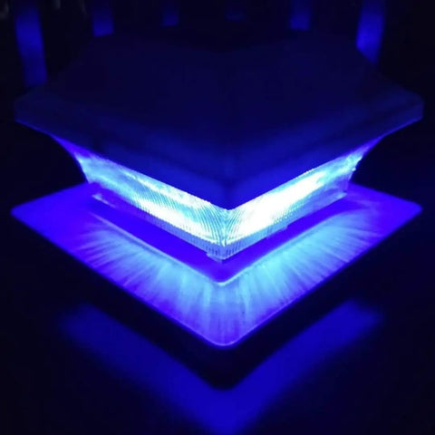 Solar Post Cap Lights Outdoor Three Color LED 20 Lumen Super Bright Waterproof Post Lamp glowing in blue light at night.