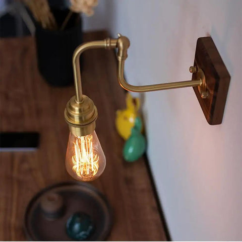 Vintage Brass Wall Sconce, Industrial Wood Light Fixture on walnut base with adjustable arm and vintage bulb.