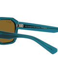 Side view of Corrigan Square Sunglasses with transparent light blue frame and dark brown polarized lenses, eco-friendly acetate.