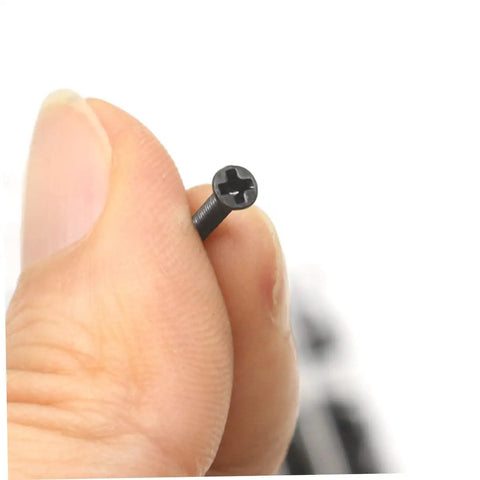 Close-up of a miniature screw from Two Piece Miniature Screw Set With Countersunk Round Screws For Small Machines Notebooks And Glasses Repair