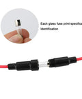 Rock Solid Auto Glass Tube Fuse Kit 150 Piece Assorted Set Loaded With 130 Fast Blow Fuses And Twenty Heavy Duty Holder Slots Packed Inside A Clear Box For Your Street Ready Rides, featuring a glass fuse held by a finger.