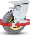Top Shelf Heavy Duty Rubber Swivel Casters With 360 Silent Locking Brakes And Precision Ball Bearings For Furniture And Rolling Cabinets 5 Inch rubber wheel with a golden hub and steel bracket.