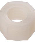 Close-up of a single white nylon hex nut, 6-32 coarse thread, part of White Nylon Hex Nuts 60 Pack Non Conductive Fasteners For Electrical Jobs And Shop Fixes.