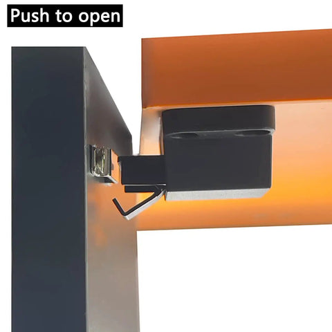 Close-up of Self Closing Push To Open Door Latch installed on a cabinet, showing the latch mechanism in black.