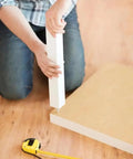 Person assembling furniture using Dowel Screws For Wood To Metal, Zinc Plated, M5 X 25mm, Dual-Thread Fasteners, Pack Of 12