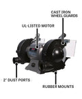 Shop Ready Six Inch Bench Grinder Powered By A Half Horsepower Motor Spinning 3450 RPM Built Different With Heavy Cast Iron Frame Includes Vitrified Aluminum Oxide Wheels Plus Attached Wire Brush For Fast Metal Prep with motor, dust ports, and wheel guards.