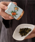 Top Tier Ceramic Food Storage Jars Set Of Twelve With Airtight Snap Lids For Spices Tea And Coffee Beans, pouring tea.