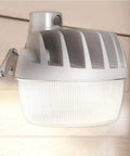 Energy Star LED dusk to dawn light with aluminum exterior, mounted on wall, ultra bright and weatherproof for outdoor use.