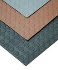 Layers of Coin Pattern Rubber Flooring 3.5mm Thick 36 Inch By 10 Foot Sheet Dark Gray No Slip Surface overlapping in different colors.