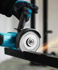 Rock Solid Electric Angle Grinder Tearing Through Metal And Wood With Knockout Torque And Adjustable Safety Guard, cutting steel.
