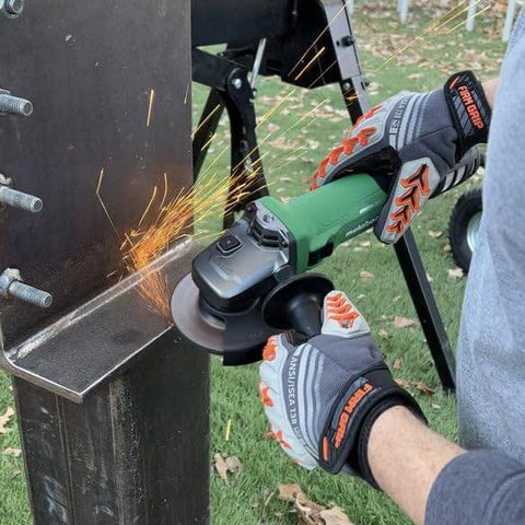 Person using Powerful 4-1/2 Inch Angle Grinder With 12 Amp AC Brushless Motor, Variable Speed on metal beam outdoors.