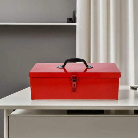 Slick Red Metal Toolbox Chest With Reinforced Carry Handle For Portable Gear Storage And Heavy Duty Tool Organization on a white table.