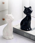 Chill Out Your Bathroom Look With This Ridiculously Cool Set Of Two Ceramic Cat Toilet Bolt Caps That Hides Exposed Bolts Hassle Free And Brings Serious Vibe In Matte Black, featuring matte black and white ceramic cats.