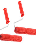 Knockout 2 Piece Wood Grain Texture Paint Roller Pair Featuring Rock Solid Grip Handle For Quick Drywall Mud Work And Real Deal Fake Timber Finish Results That Truly Stand Out with red handles and textured wheels.