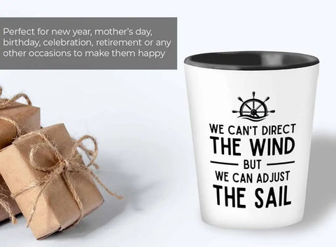 Adjustable Sailor Shot Glass 1.5oz with nautical design and quote, surrounded by wrapped gifts, perfect barware gift.