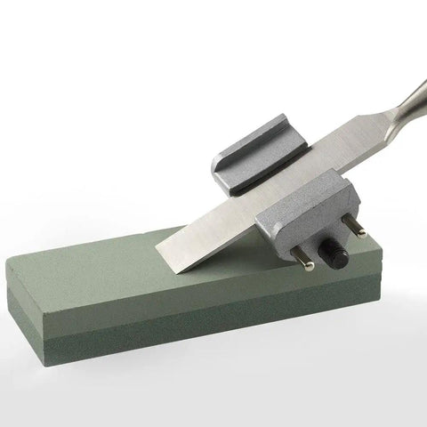6 Inch Green Silicon Oxide Sharpening Stone 2 Sided Coarse And Fine Grit For Sharpening Knives Tools And Chisels Bench Stone For Oil Or Water Lubrication 6 X 2 X 1 Inches with knife being sharpened